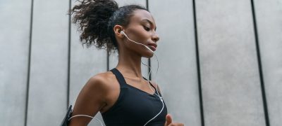 close-up-shot-of-young-woman-with-earphones-runnin-2022-2